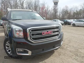 2015 GMC Yukon SLT z VIN 1GKS1BKCXFR192349, wystawiony jako IAAI lot #41842474 z przebiegiem 185 166 mil mil oraz . Historia ofert i sprzedaży dostępna na DreamBid. Obrazek 12.