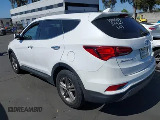 2017 Hyundai Santa Fe 2.4L z VIN 5XYZTDLB0HG403842, wystawiony jako IAAI lot #42206543 z przebiegiem 77 900 mil mil oraz . Historia ofert i sprzedaży dostępna na DreamBid. Obrazek 3.