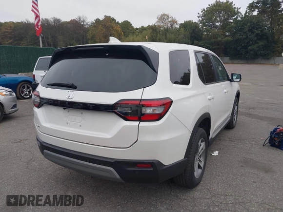 2023 Honda Pilot EX-L with VIN 5FNYG1H58PB016138, listed as a IAAI auction lot 40591717 with 10,068 mi miles and . Bid and sale history available at DreamBid. Image 4.