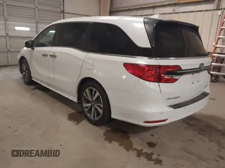 2021 Honda Odyssey Touring with VIN 5FNRL6H80MB026908, listed as a IAAI auction lot 41564765 with 116,453 mi miles. Bid and sale history available at carsss.com. Image 3.