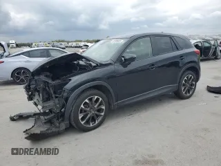2016 Mazda CX-5 Grand Touring with VIN JM3KE4DY0G0701544, listed as a Copart auction lot 52909005 with 144,621 mi miles and Salvage Title. Bid and sale history available at DreamBid. Image 1.