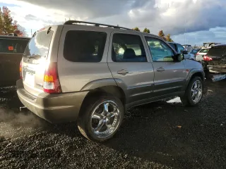 2001 Mazda Tribute LX with VIN 4F2CU08141KM64641, listed as a Copart auction lot 78269324 with 175,438 mi miles and Salvage Title. Bid and sale history available at DreamBid. Image 3.