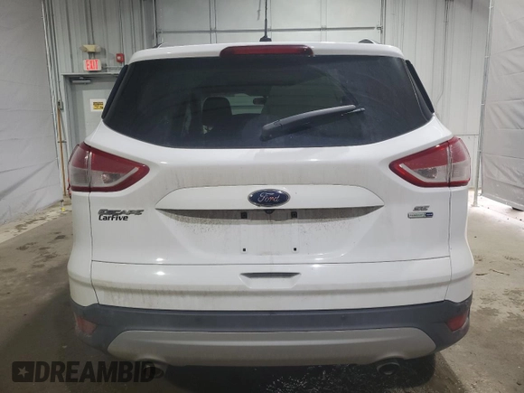 2016 Ford Escape SE with VIN 1FMCU9GX0GUB42503, listed as a Copart auction lot 50174515 with 130,204 mi miles and Salvage Title. Bid and sale history available at DreamBid. Image 6.