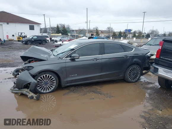 2017 Ford Fusion Hybrid Titanium z VIN 3FA6P0RU6HR279726, wystawiony jako IAAI lot #41736889 z przebiegiem 123 698 mil mil oraz . Historia ofert i sprzedaży dostępna na DreamBid. Obrazek 14.