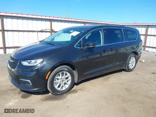 2023 Chrysler Pacifica Touring L with VIN 2C4RC1BG3PR533863, listed as a IAAI auction lot 42067253 with 61,868 mi miles. Bid and sale history available at carsss.com. Image 2.