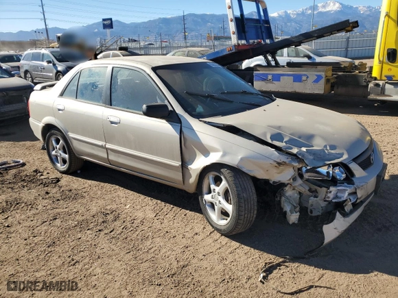 2001 Mazda Protege LX with VIN JM1BJ225410414507, listed as a Copart auction lot 83803284 with 189,914 mi miles and Salvage Title. Bid and sale history available at carsss.com. Image 4.