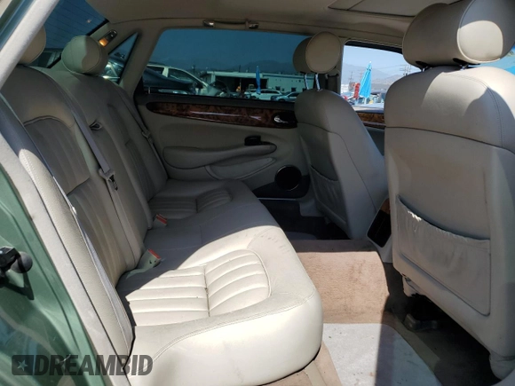 1999 Jaguar XJ with VIN SAJHX604XXC854217, listed as a Copart auction lot 56042735 with 127,092 mi miles and Salvage title. Bid and sale history available at DreamBid. Image 10.