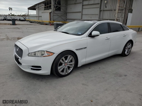 2014 Jaguar XJ with VIN SAJWJ2GD6E8V65987, listed as a Copart auction lot 50091105 with 136,080 mi miles and Clean Title. Bid and sale history available at carsss.com. Image 1.