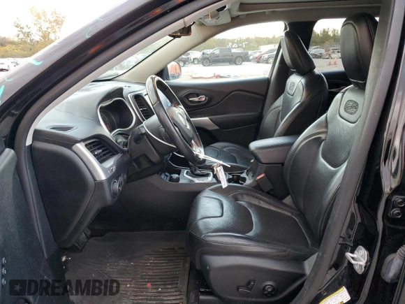 2018 Jeep Cherokee Overland with VIN 1C4PJMJX8JD562138, listed as a Copart auction lot 77249404 with 119,865 mi miles and Salvage Title. Bid and sale history available at carsss.com. Image 7.