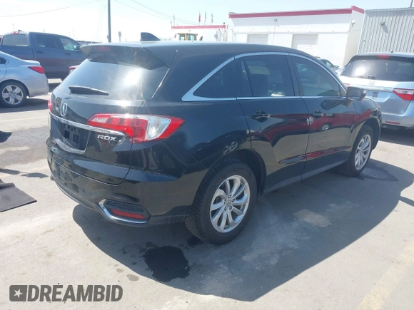 2017 Acura RDX Technology with VIN 5J8TB3H56HL014036, listed as a IAAI auction lot 41980079 with 124,683 mi miles and . Bid and sale history available at DreamBid. Image 4.