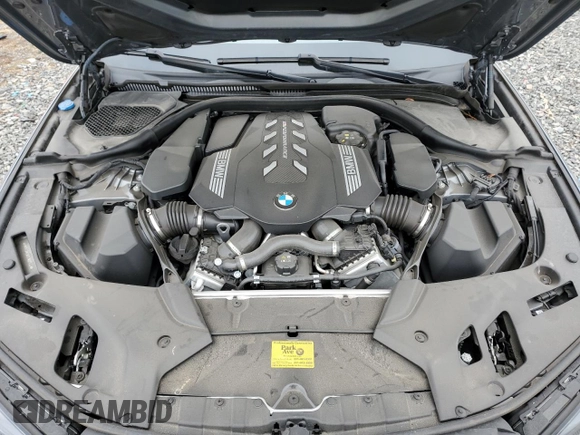 2023 BMW 5 Series M550i xDrive with VIN WBA13BK06PCN02733, listed as a Copart auction lot 48767235 with 27,725 mi miles and Salvage title. Bid and sale history available at DreamBid. Image 11.