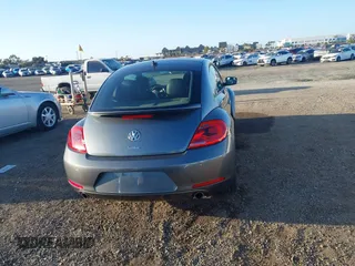 2012 Volkswagen Beetle 2.0T Turbo w/Sun/Snd/Nav PZEV with VIN 3VWVA7AT4CM628968, listed as a IAAI auction lot 41847614 with 71,813 mi miles. Bid and sale history available at carsss.com. Image 17.
