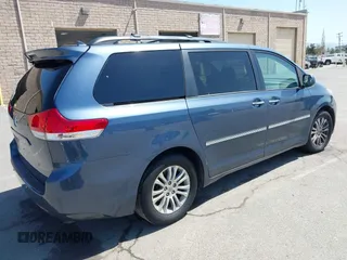 2014 Toyota Sienna XLE with VIN 5TDYK3DC5ES447155, listed as a IAAI auction lot 42003951 with 60,064 mi miles and . Bid and sale history available at DreamBid. Image 4.