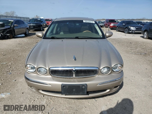 2004 Jaguar X-Type with VIN SAJEA51C64WD66013, listed as a Copart auction lot 50635615 with 47,365 mi miles and Salvage Title. Bid and sale history available at carsss.com. Image 5.
