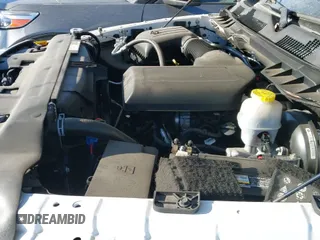 2021 Ram 1500 Tradesman z VIN 1C6RR6FG2MS506595, wystawiony jako IAAI lot #41169146 z przebiegiem 43 726 mil mil oraz . Historia ofert i sprzedaży dostępna na DreamBid. Obrazek 19.