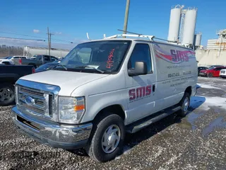 2014 Ford Econoline Cargo Commercial with VIN 1FTNE2EW3EDA18900, listed as a IAAI auction lot 41209002 with 138,014 mi miles. Bid and sale history available at carsss.com. Image 2.