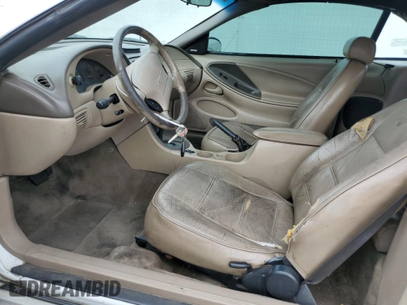 2004 Ford Mustang Deluxe z VIN 1FAFP44454F123067, wystawiony jako Copart lot #86784474 z przebiegiem 161 541 mil mil oraz Szkoda całkowita • Salvage title. Historia ofert i sprzedaży dostępna na DreamBid. Obrazek 7.