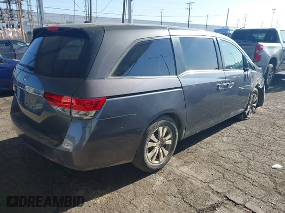 2014 Honda Odyssey EX-L with VIN 5FNRL5H61EB079742, listed as a IAAI auction lot 41992473 with 125,397 mi miles and . Bid and sale history available at carsss.com. Image 4.