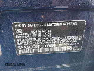 2019 BMW 5 Series 530e iPerformance with VIN WBAJA9C59KB389898, listed as a IAAI auction lot 41479595 with 90,965 mi miles. Bid and sale history available at carsss.com. Image 9.