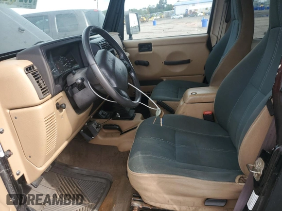 2000 Jeep Wrangler Sahara with VIN 1J4FA59S5YP761127, listed as a Copart auction lot 65247225 with 174,274 mi miles and Clean title. Bid and sale history available at DreamBid. Image 7.
