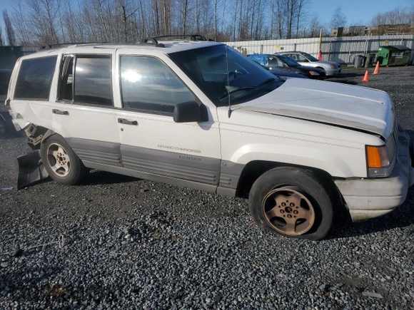 1996 Jeep Grand Cherokee Laredo with VIN 1J4EX58S3TC110154, listed as a Copart auction lot 46947805 with 268,507 mi miles and Salvage Title. Bid and sale history available at carsss.com. Image 4.