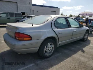 1997 Dodge Stratus z VIN 1B3EJ56H0VN679440, wystawiony jako Copart lot #71977454 z przebiegiem 83 367 mil mil oraz Tytuł czysty. Historia ofert i sprzedaży dostępna na DreamBid. Obrazek 3.