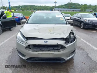 2016 Ford Focus SE z VIN 1FADP3F26GL332224, wystawiony jako IAAI lot #42167222 z przebiegiem 134 423 mil mil oraz . Historia ofert i sprzedaży dostępna na DreamBid. Obrazek 12.