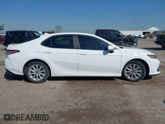 2019 Toyota Camry LE with VIN 4T1B11HK9KU825107, listed as a IAAI auction lot 41971159 with 15,802 mi miles and . Bid and sale history available at DreamBid. Image 13.
