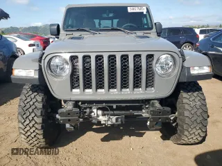 2023 Jeep Gladiator Rubicon with VIN 1C6JJTBG8PL550219, listed as a Copart auction lot 54627685 with 9,671 mi miles and Salvage title. Bid and sale history available at DreamBid. Image 5.