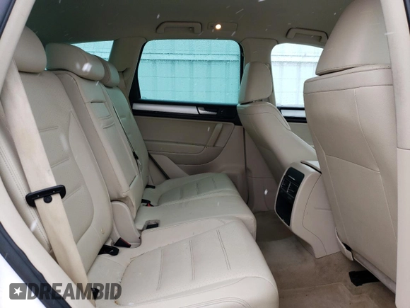 2011 Volkswagen Touareg Sport with VIN WVGFF9BP8BD002982, listed as a Copart auction lot 53958555 with 156,742 mi miles and Salvage Title. Bid and sale history available at DreamBid. Image 11.