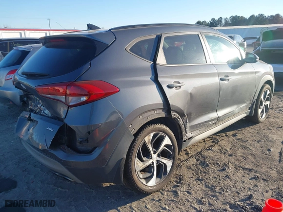 2018 Hyundai Tucson Value with VIN KM8J3CA2XJU776526, listed as a IAAI auction lot 41322657 with 102,444 mi miles. Bid and sale history available at carsss.com. Image 4.