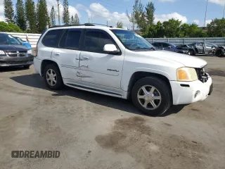 2005 GMC Envoy Denali z VIN 1GKES63MX52321416, wystawiony jako Copart lot #57587575 z przebiegiem 252 571 mil mil oraz Szkody całkowita. Historia ofert i sprzedaży dostępna na DreamBid. Obrazek 4.