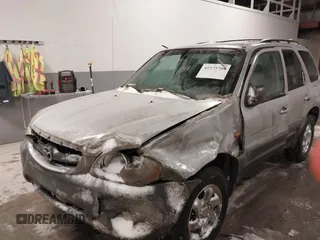 2003 Mazda Tribute DX with VIN 4F2YZ02B73KM43813, listed as a IAAI auction lot 41575708 with 202,214 mi miles and . Bid and sale history available at carsss.com. Image 2.