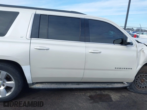 2015 Chevrolet Suburban LT with VIN 1GNSKJKC0FR309866, listed as a IAAI auction lot 41743848 with 220,778 mi miles and . Bid and sale history available at DreamBid. Image 13.
