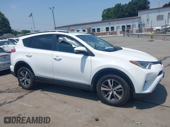 2018 Toyota RAV4 XLE z VIN 2T3WFREV1JW459553, wystawiony jako IAAI lot #42423474 z przebiegiem 129 523 mil mil oraz . Historia ofert i sprzedaży dostępna na DreamBid. Obrazek 13.