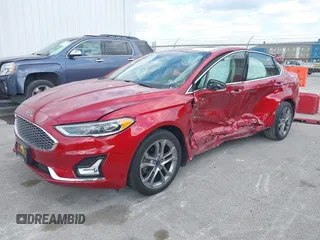 2020 Ford Fusion Hybrid Titanium with VIN 3FA6P0RU7LR156915, listed as a IAAI auction lot 40738652 with 82,836 mi miles. Bid and sale history available at carsss.com. Image 2.