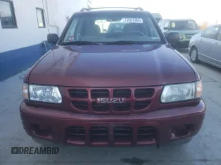 2002 Isuzu Rodeo S with VIN 4S2DM58W824313096, listed as a Copart auction lot 77951364 with 127,470 mi miles and Salvage Title. Bid and sale history available at DreamBid. Image 5.