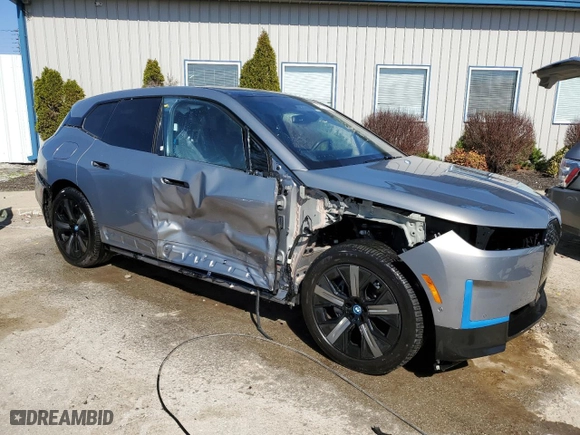 2023 BMW iX xDrive50 with VIN WB523CF09PCM73862, listed as a Copart auction lot 47110985 with 17,521 mi miles and Salvage Title. Bid and sale history available at carsss.com. Image 4.