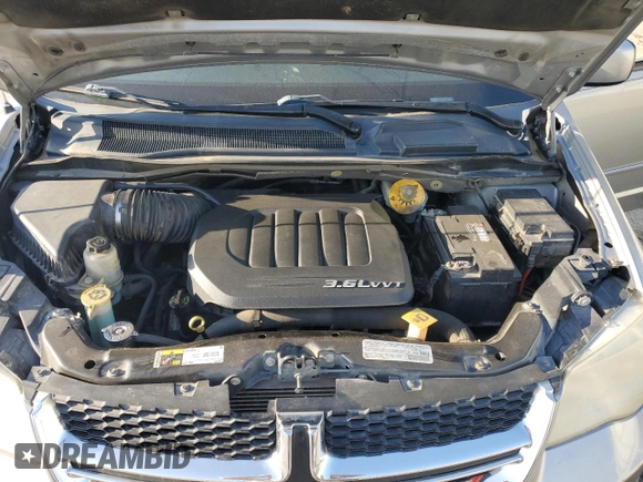 2014 Dodge Grand Caravan SXT with VIN 2C4RDGCG1ER121033, listed as a Copart auction lot 52030715 with 105,451 mi miles and Salvage Title. Bid and sale history available at DreamBid. Image 12.