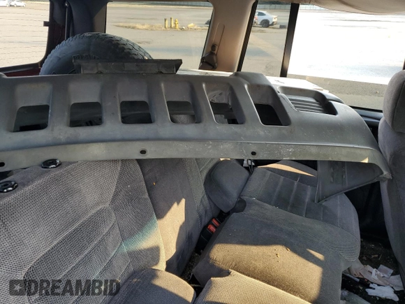 1996 Jeep Grand Cherokee z VIN 1J4EZ58Y5TC142263, wystawiony jako Copart lot #70532894 z przebiegiem Nie podano mil oraz Szkoda całkowita • Salvage title. Historia ofert i sprzedaży dostępna na DreamBid. Obrazek 12.