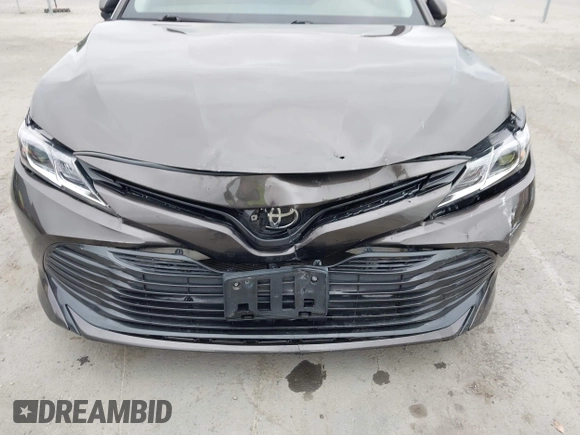 2019 Toyota Camry LE z VIN 4T1B11HK7KU702244, wystawiony jako IAAI lot #42073380 z przebiegiem 72 602 mil mil oraz . Historia ofert i sprzedaży dostępna na DreamBid. Obrazek 6.