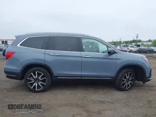 2022 Honda Pilot Touring 7-Passenger with VIN 5FNYF6H68NB056077, listed as a IAAI auction lot 42357338 with 18,193 mi miles and . Bid and sale history available at DreamBid. Image 13.