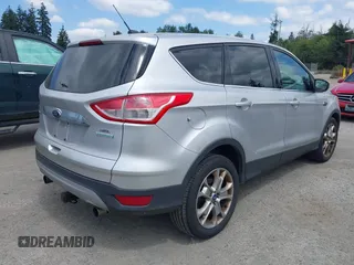 2013 Ford Escape SEL with VIN 1FMCU0HX5DUB53695, listed as a IAAI auction lot 42795881 with 165,330 mi miles and . Bid and sale history available at DreamBid. Image 4.