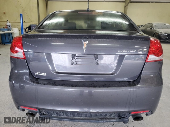 2009 Pontiac G8 z VIN 6G2ER57769L192376, wystawiony jako Copart lot #58634365 z przebiegiem 206 095 mil mil oraz Tytuł czysty. Historia ofert i sprzedaży dostępna na DreamBid. Obrazek 6.