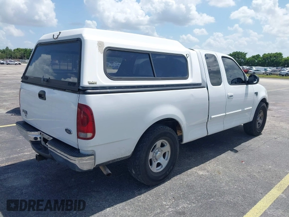 2003 Ford F-150 XL with VIN 1FTRX17W53NA40472, listed as a IAAI auction lot 42491035 with Not provided miles and . Bid and sale history available at DreamBid. Image 4.