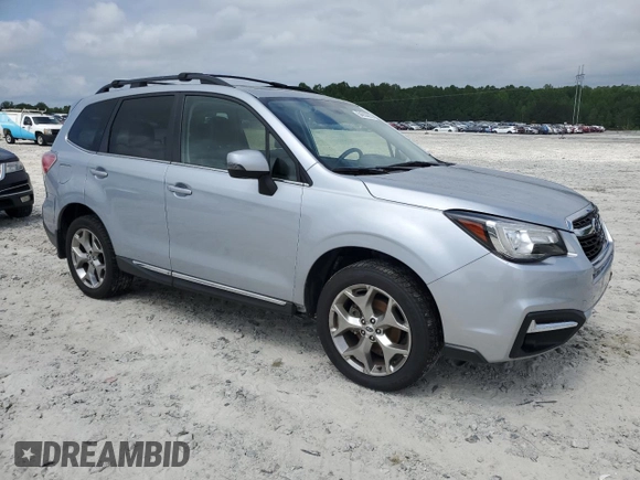 2017 Subaru Forester Touring with VIN JF2SJAWC6HH556728, listed as a Copart auction lot 54914055 with 112,686 mi miles and Salvage title. Bid and sale history available at DreamBid. Image 4.
