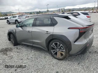 2024 Toyota bZ4X XLE with VIN JTMAAAAA8RA045760, listed as a Copart auction lot 50996385 with 3,833 mi miles and Salvage Title. Bid and sale history available at DreamBid. Image 2.