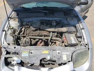 2001 Pontiac Sunfire SE z VIN 1G2JB124817315601, wystawiony jako Copart lot #63543704 z przebiegiem 147 535 mil mil oraz Szkody całkowita. Historia ofert i sprzedaży dostępna na DreamBid. Obrazek 12.
