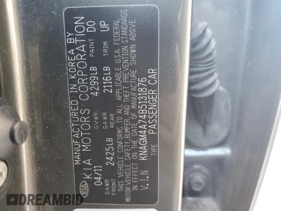 2011 Kia Optima LX z VIN KNAGM4A74B5131876, wystawiony jako Copart lot #69256644 z przebiegiem 117 718 mil mil oraz Szkoda całkowita • Salvage title. Historia ofert i sprzedaży dostępna na DreamBid. Obrazek 12.