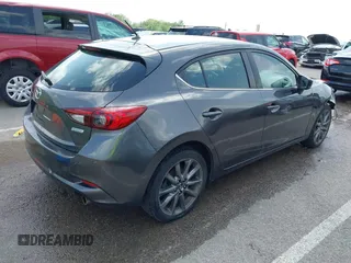 2018 Mazda 3 Touring z VIN 3MZBN1L35JM271525, wystawiony jako IAAI lot #42112552 z przebiegiem 107 299 mil mil oraz . Historia ofert i sprzedaży dostępna na DreamBid. Obrazek 4.
